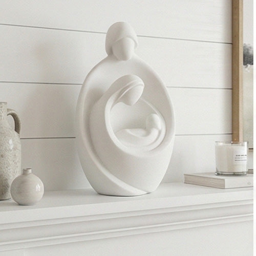 White abstract sculpture on a table with city skyline in the background